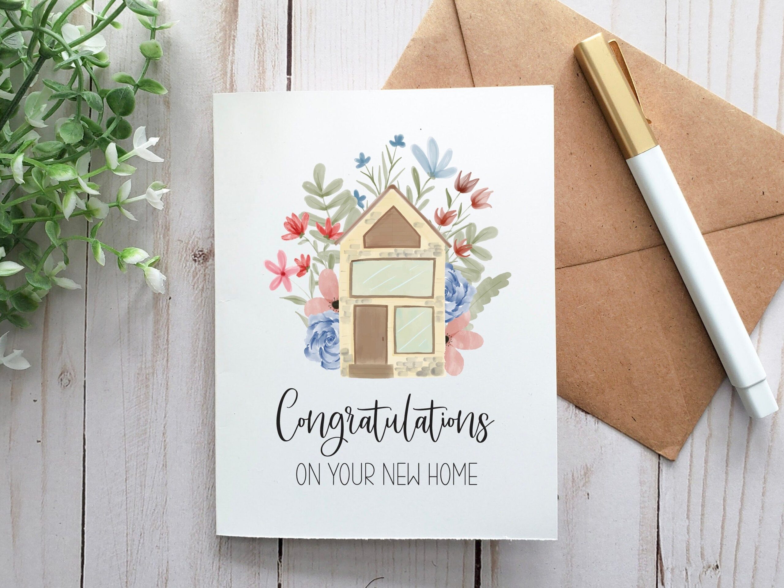 A Card That Says Congratulations On Your New Home Next To A Pen And 
